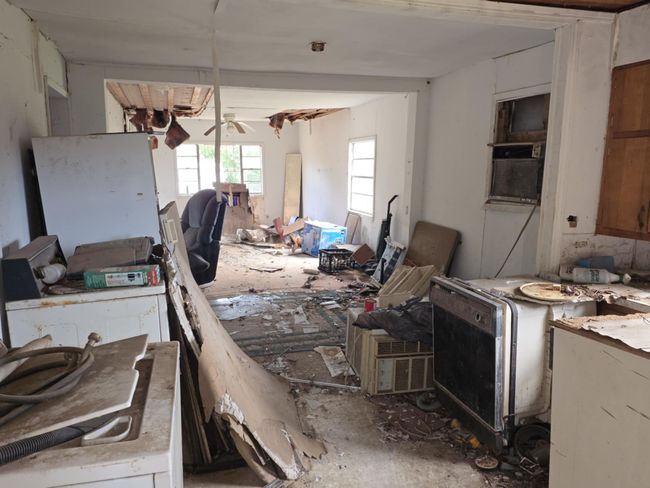 Kitchen featuring a ceiling fan and washer / dryer | Image 12