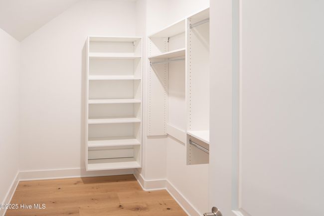 Hall to master Bedroom and downstairs garage | Image 124