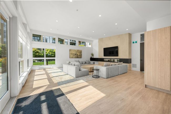 Living room with recessed lighting, visible vents, and light wood-type flooring | Image 25