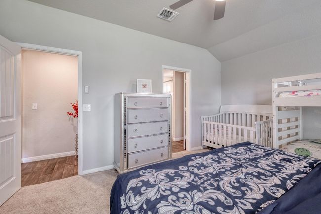 Carpeted bedroom featuring baseboards, ceiling fan | Image 17