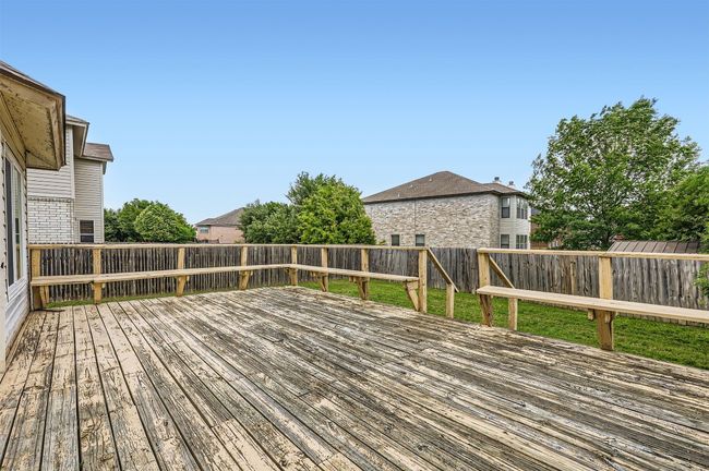 Wooden terrace featuring a fenced backyard | Image 27