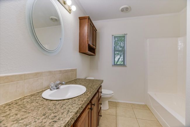 Shared Bathroom is roomy and has a tub/ shower comp | Image 16