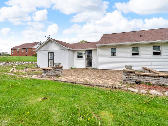 rear view of house with a lawn and a patio area | Image 36