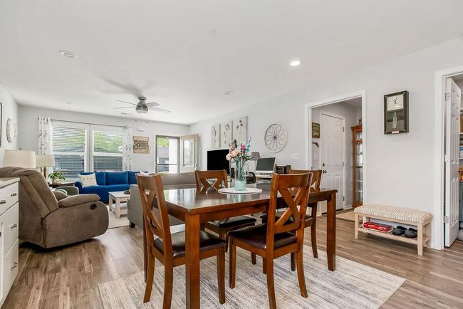 Dining space with recessed lighting, light wood finished floors, and a ceiling fan | Image 13