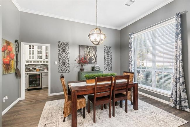 This dining room works well for formal entertaining or make it casual! It can accommodate a large crowd and large scale furniture. | Image 10