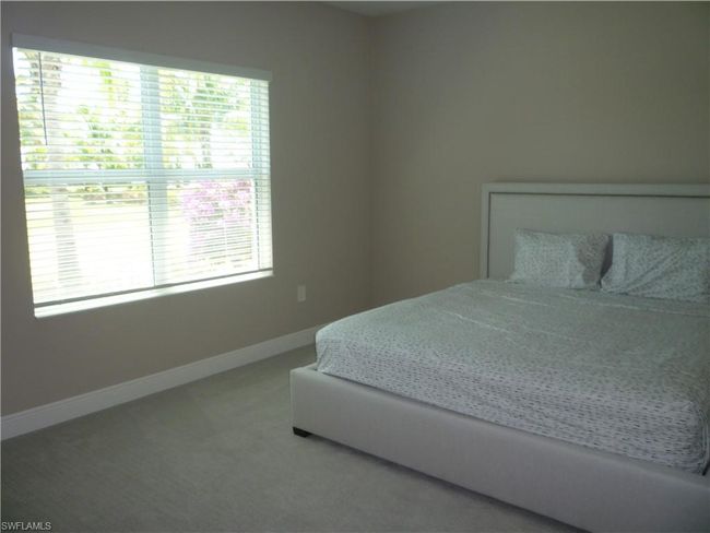 Master Bedroom overlooking landscaped area | Image 7