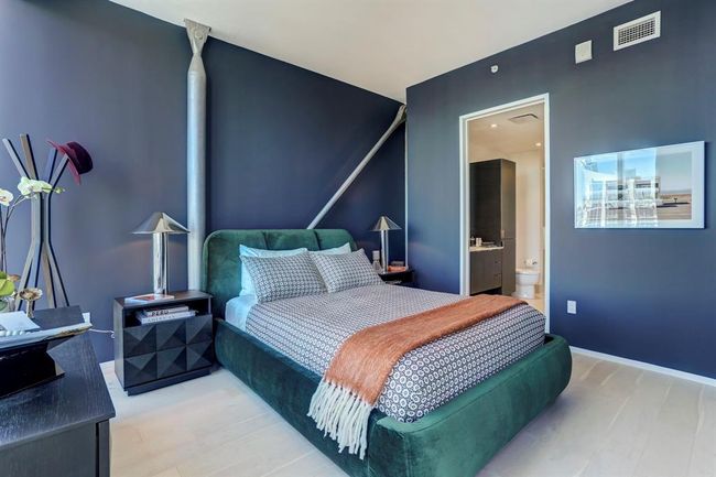 Bedroom with connected bathroom and baseboards | Image 11