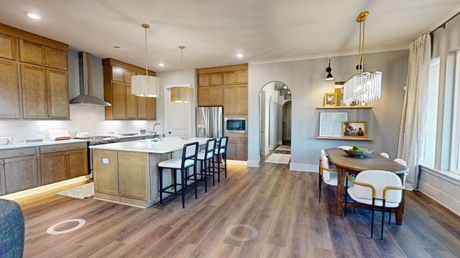 Our homeowners love this entertainment space. See additional photo for design selections going into this home including a luxury cabinet hood :) *Photo is of existing model and used for marketing purposes only | Image 5