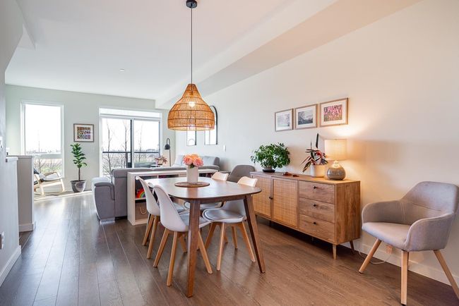 Dining area featuring wood finished floors and baseboards | Image 11