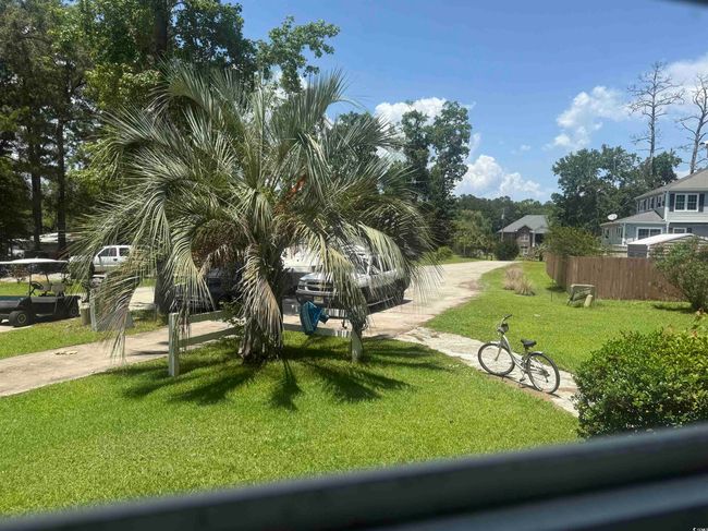 View of yard with driveway | Image 17