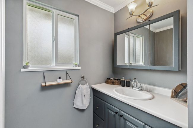 Bathroom with crown molding and vanity | Image 24