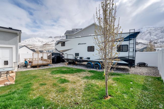 View of yard with a fenced backyard and a mountain view | Image 29
