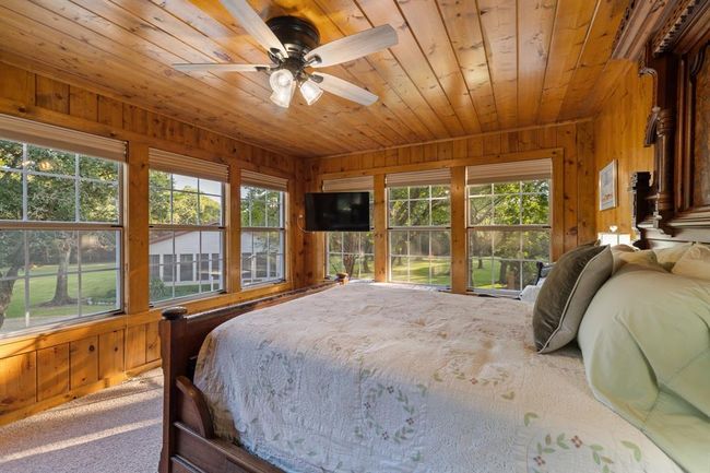 Guest bedroom located on the second level. | Image 23
