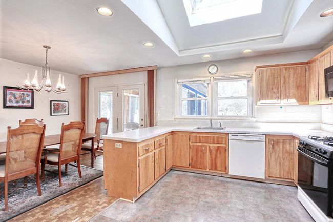 Kitchen with dishwasher, a wealth of natural light, range with gas stovetop, and recessed lighting | Image 10