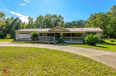 Single story home with a garage and a front yard | Image 2