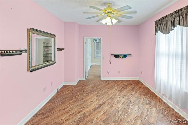Spare room featuring light wood-style floors and a ceiling fan | Image 31
