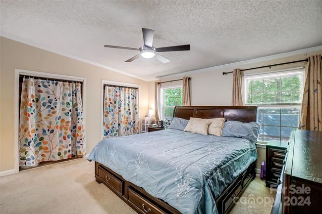 The primary bedroom is waiting to become your own private oasis. | Image 19