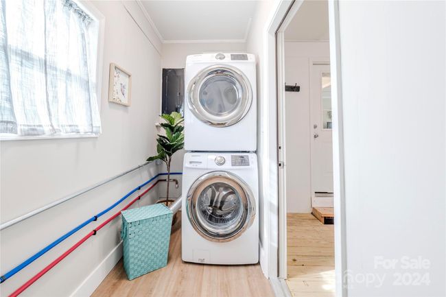 A stackable washer/dryer are included with acceptable offer! Laundry room is insulated and Heat and Air are flowing into this space! | Image 36