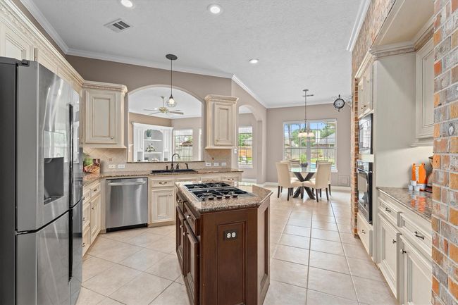 Stainless appliances, and a rustic brick accent make this a chef's dream | Image 15