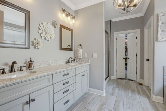 Ensuite bathroom with double vanities and walk-in closet | Image 13