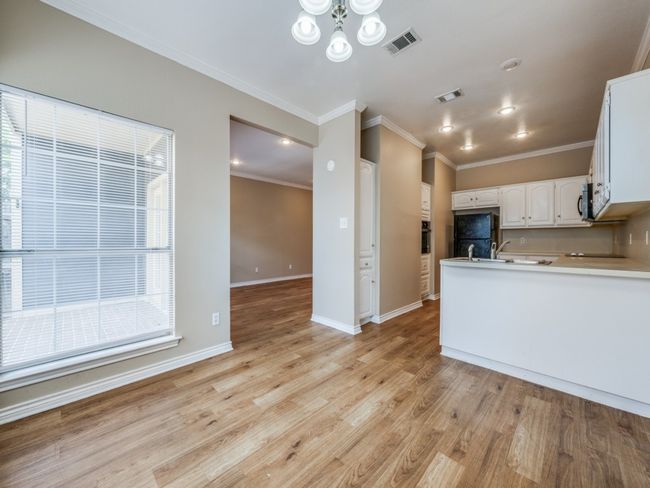 Dining area in kitchen with breakfast bar | Image 8