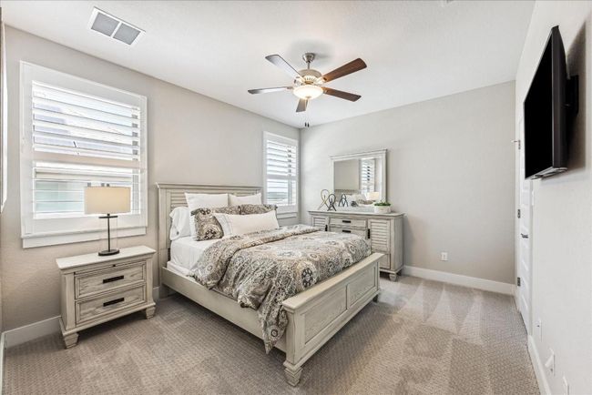 Each bedroom upstairs features a ceiling fan, walk in closet and shutters that allow you to easily control the amount of sunlight that comes into the room. | Image 28