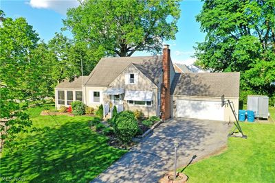 View of front of house featuring a front lawn and a garage | Image 2