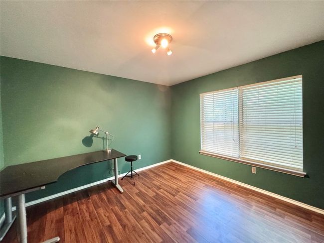 Unfurnished office with wood finished floors and baseboards | Image 9