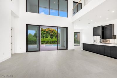 Unfurnished living room featuring light tile patterned flooring | Image 3