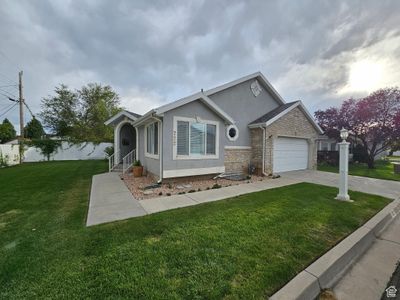 View of front facade featuring a garage and a front yard | Image 2