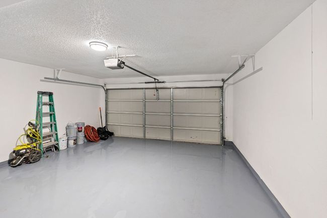 Garage with a garage door opener | Image 28