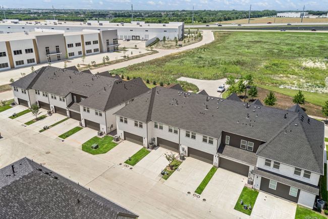 With a spacious two car garage and driveway, you'll enjoy plenty of private, off street parking in this beautiful home! | Image 18