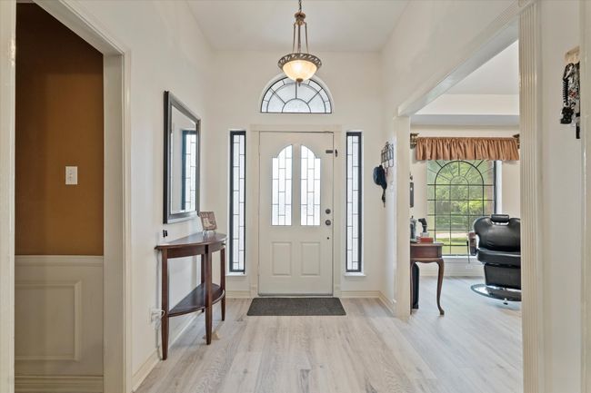 Entryway with light wood finished floors | Image 6