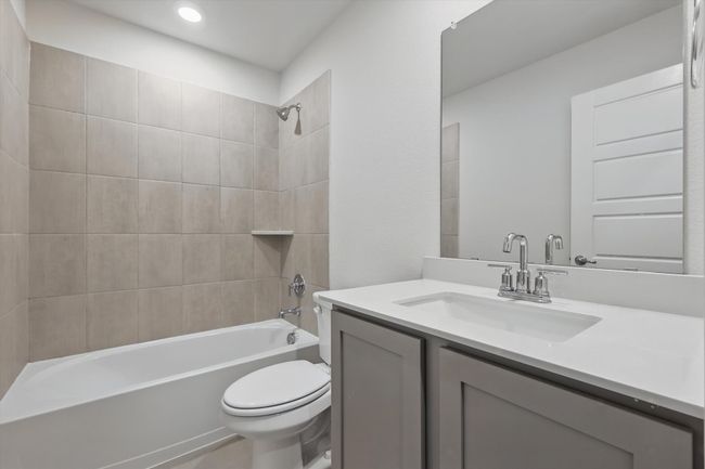 Bathroom with vanity, bathtub / shower combination, and recessed lighting | Image 25