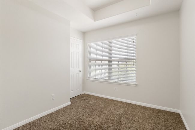 Carpeted empty room with baseboards | Image 24