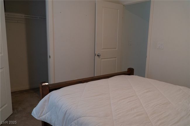 Bedroom with baseboards, carpet floors, and a closet | Image 16
