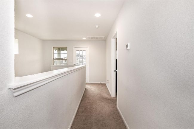 Corridor with carpet, recessed lighting, and an upstairs landing | Image 31
