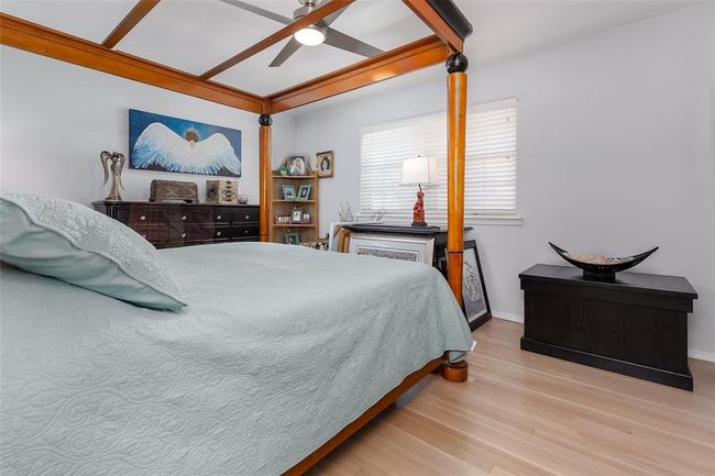 Bedroom featuring ceiling fan and light hardwood / wood-style flooring | Image 21