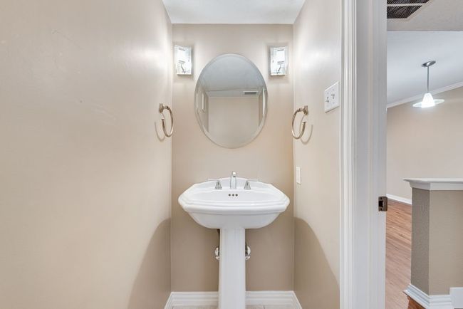Bathroom featuring visible vents, baseboards, and wood finished floors | Image 12