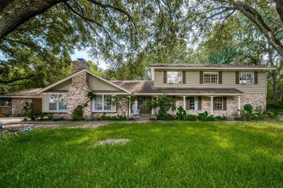 Welcome to your dream home! This charming two-story home sits majestically on 2 acres of lush land, offering a perfect blend of space, serenity, and endless possibilities. | Image 1