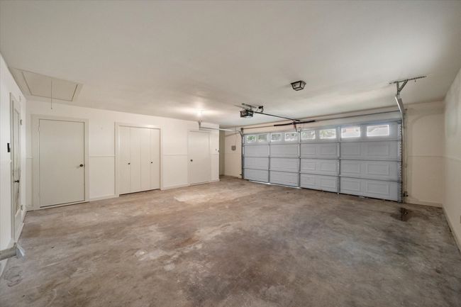 Garage with a garage door opener | Image 34