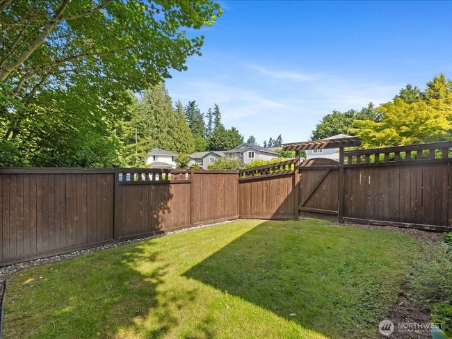 Fenced in back yard | Image 32