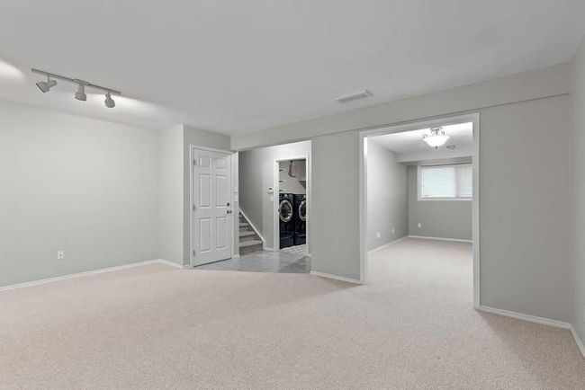 76 Coach Gate Way Sw, House other with 3 bedrooms, 2 bathrooms and 4 parking in Calgary AB | Image 32