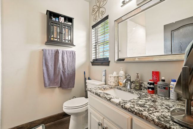 Bathroom featuring vanity and toilet | Image 22