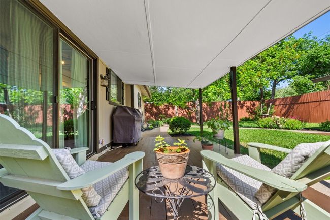 With easy access from the living areas, the covered deck is perfect for enjoying the outdoors in comfort and privacy. | Image 27
