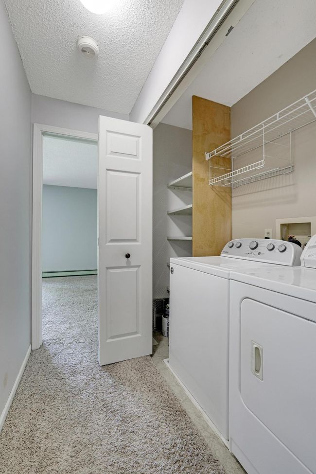 Conveniently placed laundry closet just outside the bedroom. | Image 12