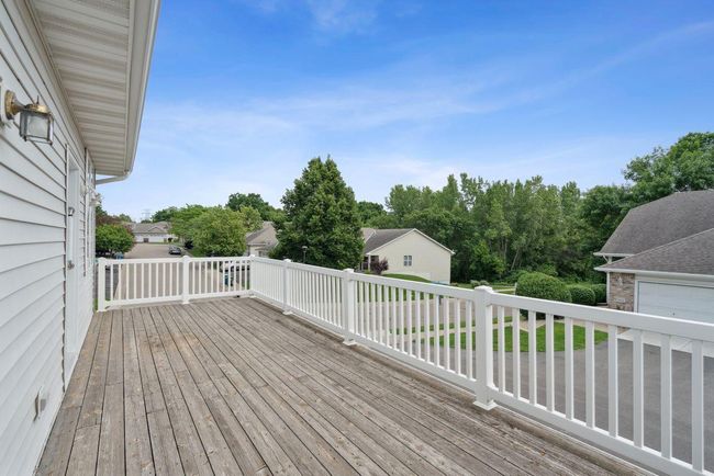 Very large (28x10) deck with maintenance free vinyl railing. Access to interior living room & private slider to owner suite. | Image 27