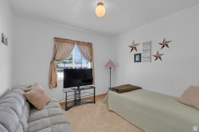 Bedroom with light colored carpet | Image 16