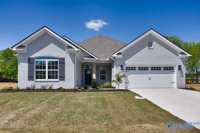 Discover luxury in this spacious 3-bed, 2.5-bath, 2490 sq ft home on a generous lot. Enjoy a covered veranda, dream kitchen, large office and master suite oasis. | Image 1