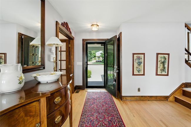Foyer featuring stairway and light wood finished floors | Image 37